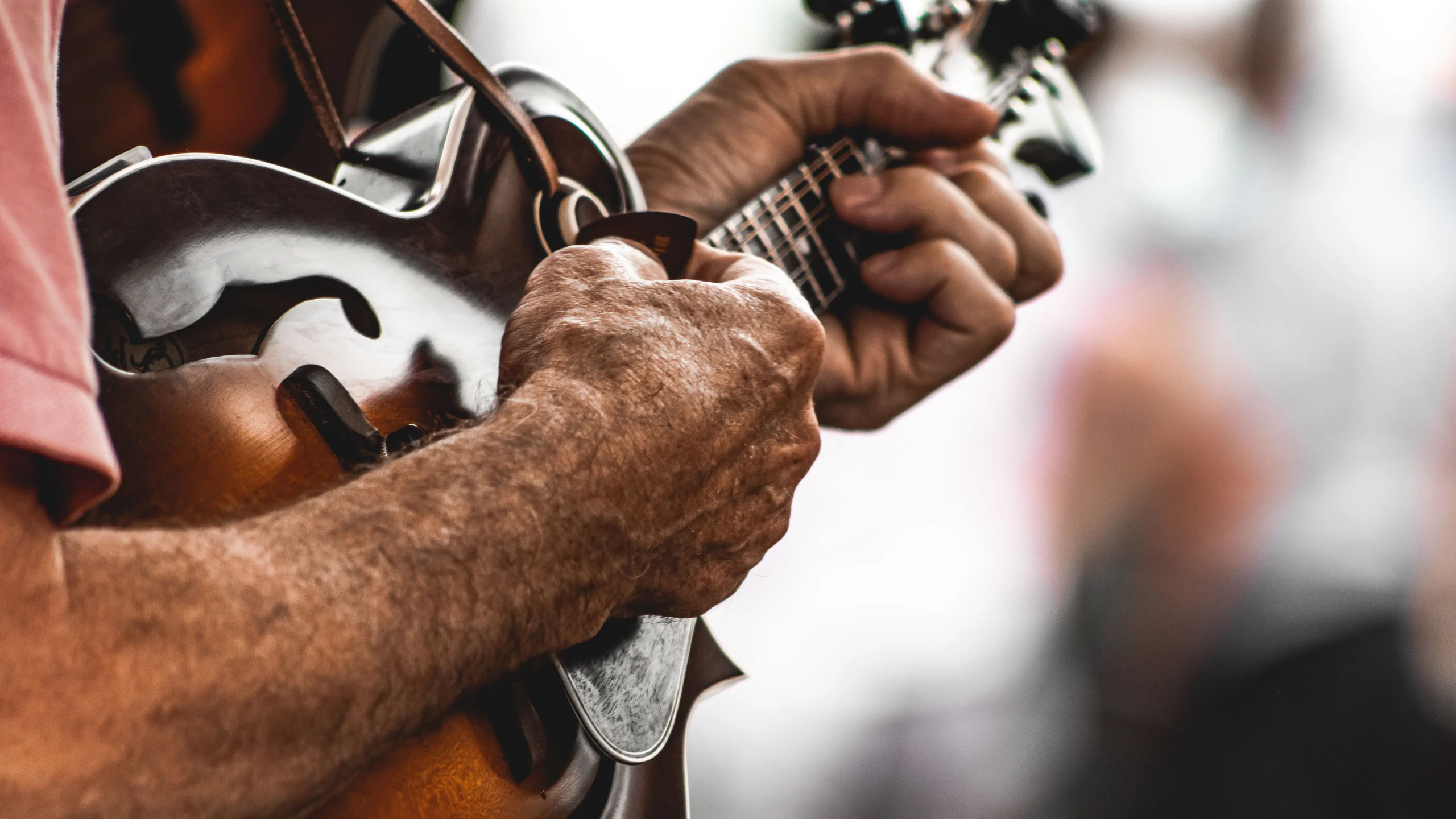 old-man-hands-playing-mandolin- farm market apples